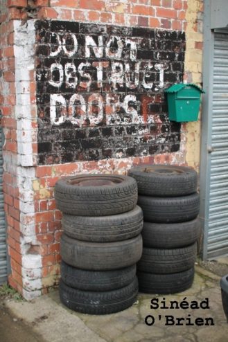 outside garage wall with message "do not obstruct doors"