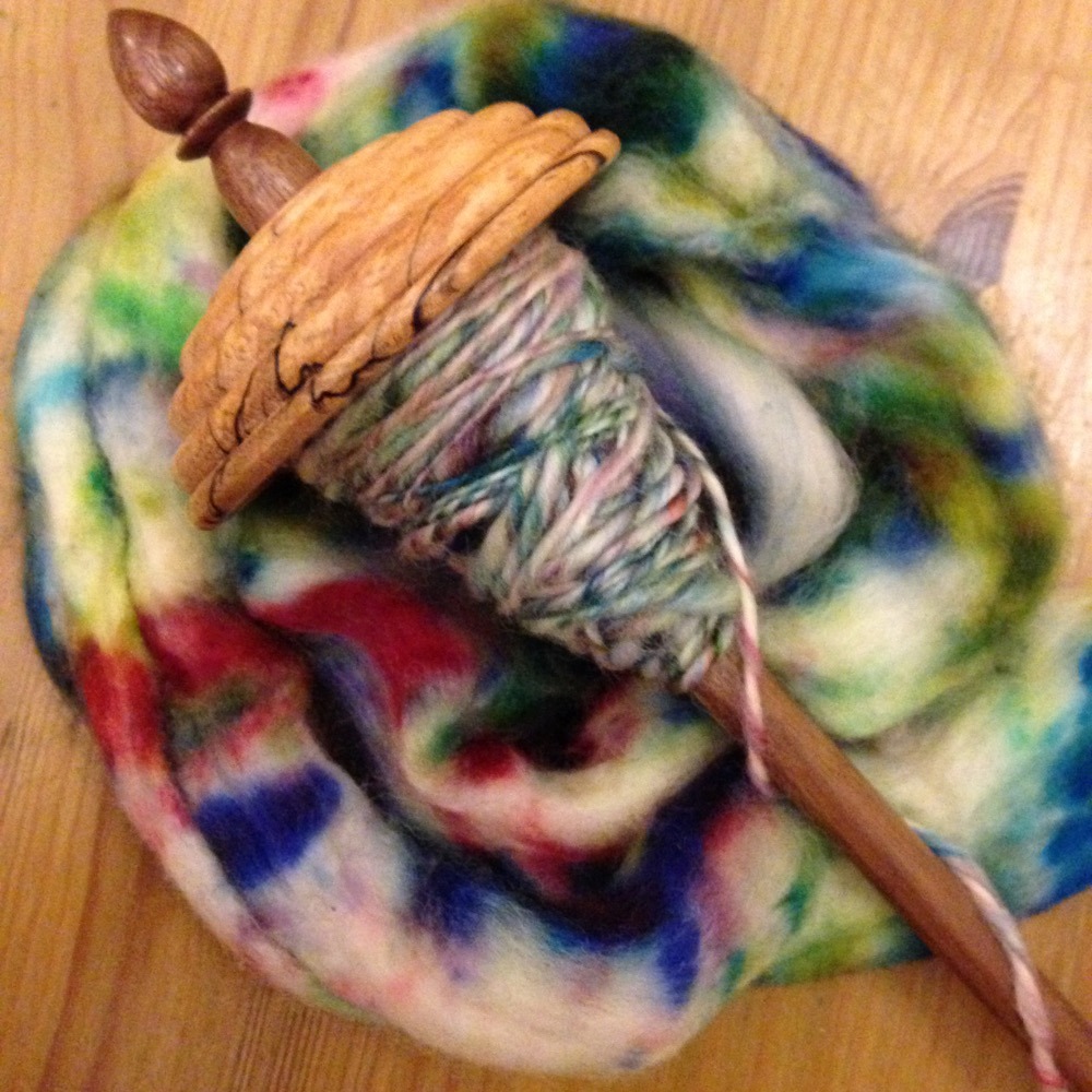 hand spun mottled yarn on drop spindle