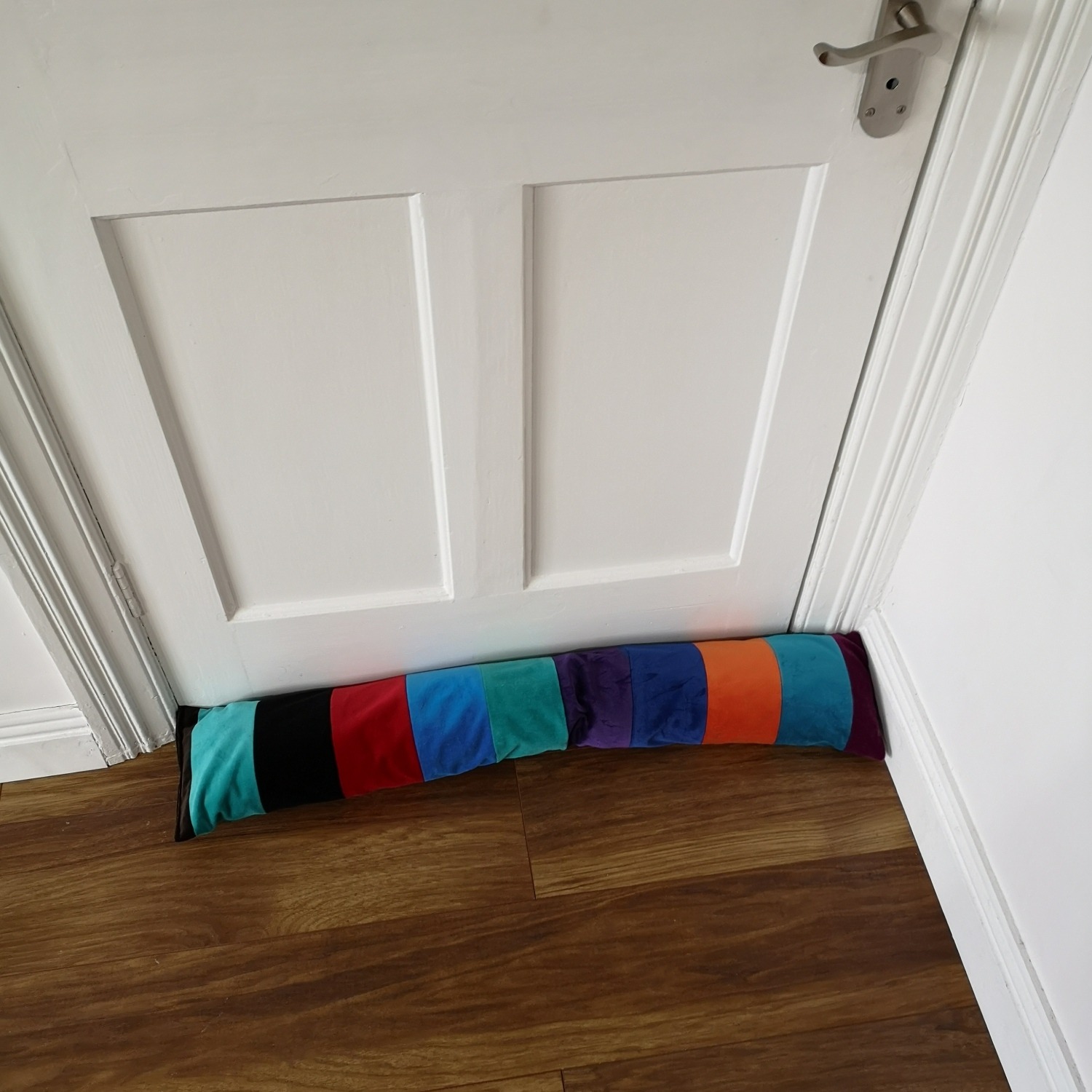 Finished draught excluder against a door